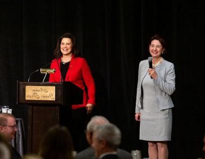 Birgit Klohs and Governor Gretchen Whitmer on stage