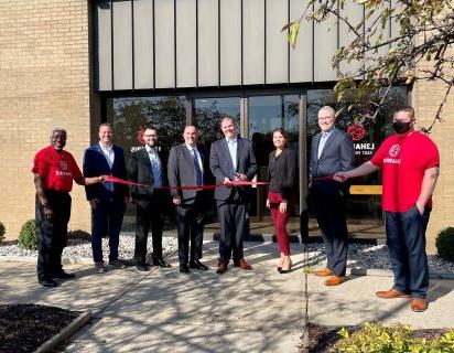 L3Harris Technologies, Inc with The Right Place President/CEO Randy Thelen in front of new building for ribbon cutting ceremony